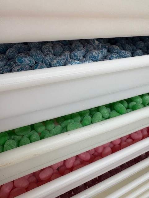 White drawers filled with jelly beans